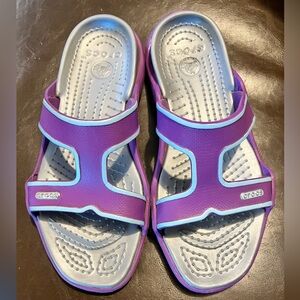 Crocs swift water slide sandals in purple
With light blue trim, silver sole sz 9